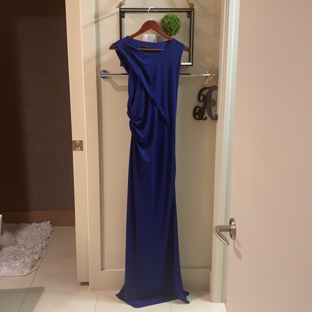 BCBG long elegant dress fits extremely well enhancing curves w/o showing “xtras”